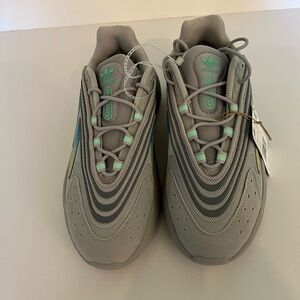Adidas Originals Ozelia women’s sneakers. Grey & yellow stripes. Size 8.5. NWT.